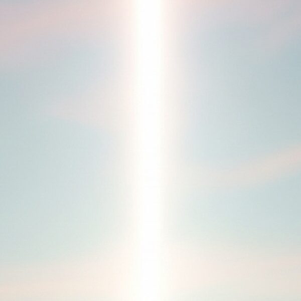 A fantasy landscape depicting ancient ruins under a divine light, representative of the world of "Paladin of Souls."