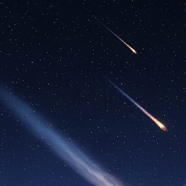 A detailed view from a celestial body's surface showing Earth and its Moon in the distance, with a trajectory of fiery meteoroids approaching.